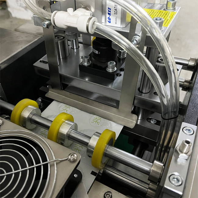 Automatic condom special-shaped packaging machine