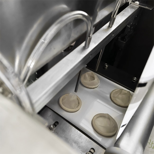 Automatic condom packaging machine