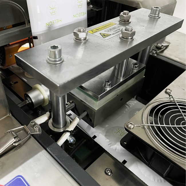 Automatic condom special-shaped packaging machine