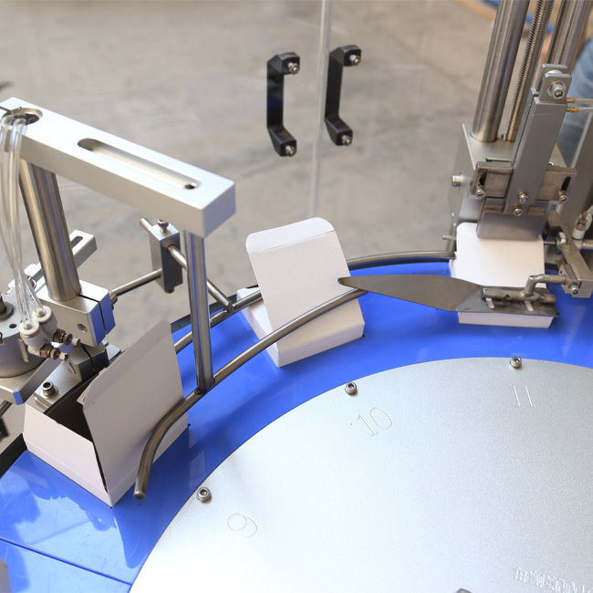 Top opening cartoning machine